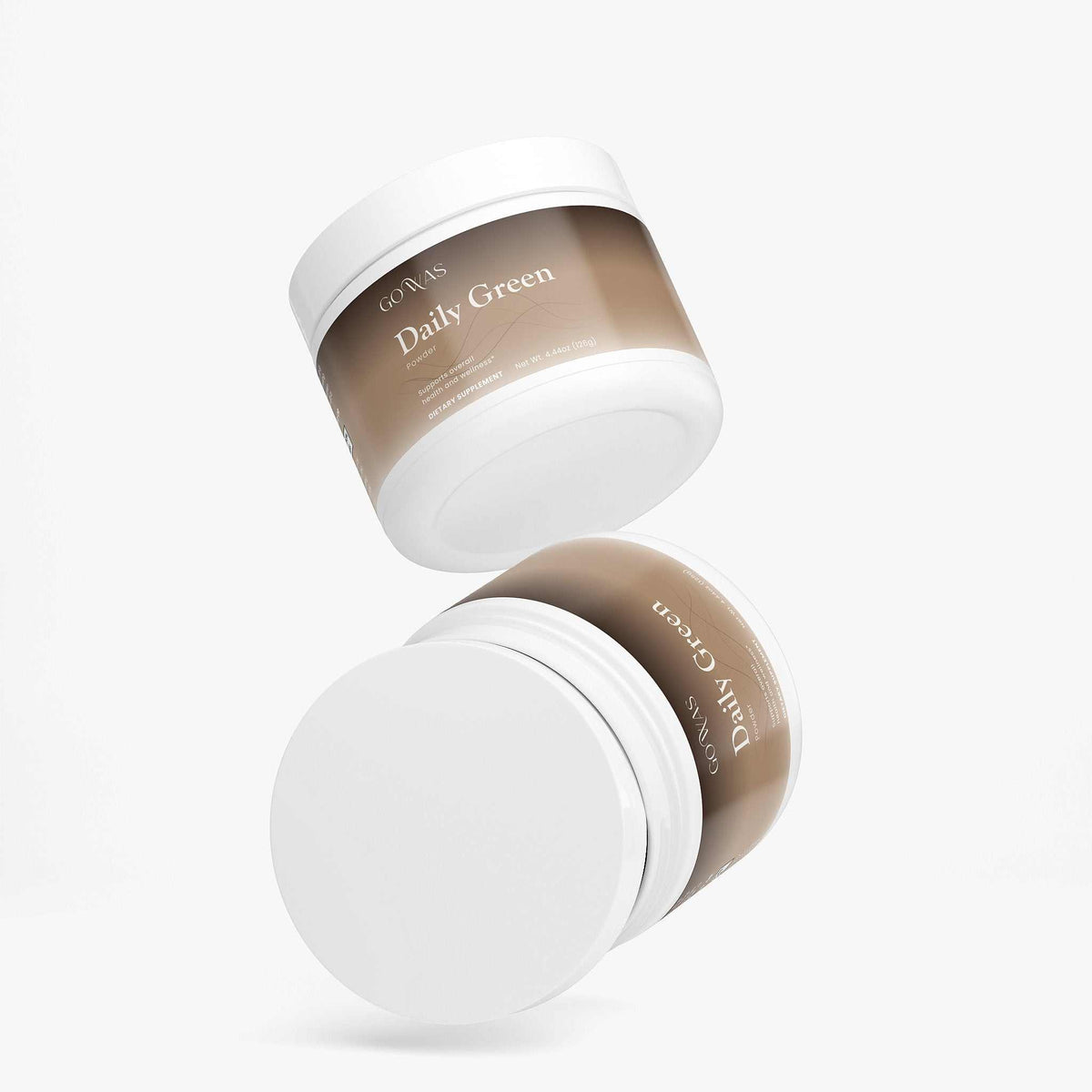 Daily Greens greens powder supplement in white tubs with beige labels and clean white screw-top lids.