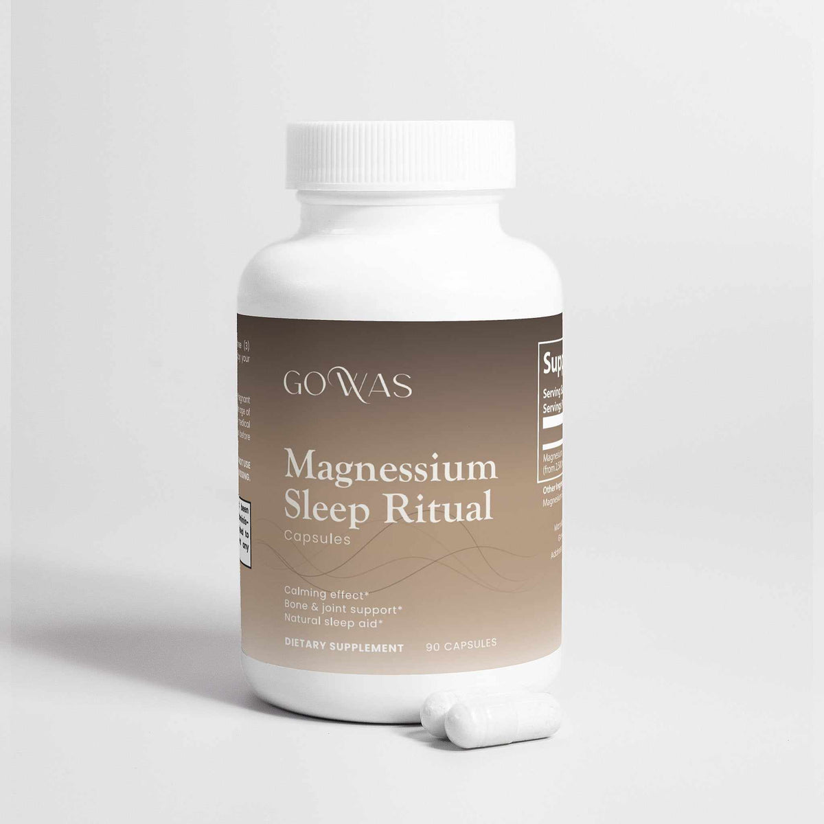 Magnesium Sleep Ritual supplement in a white bottle with a brown label and white capsules beside it